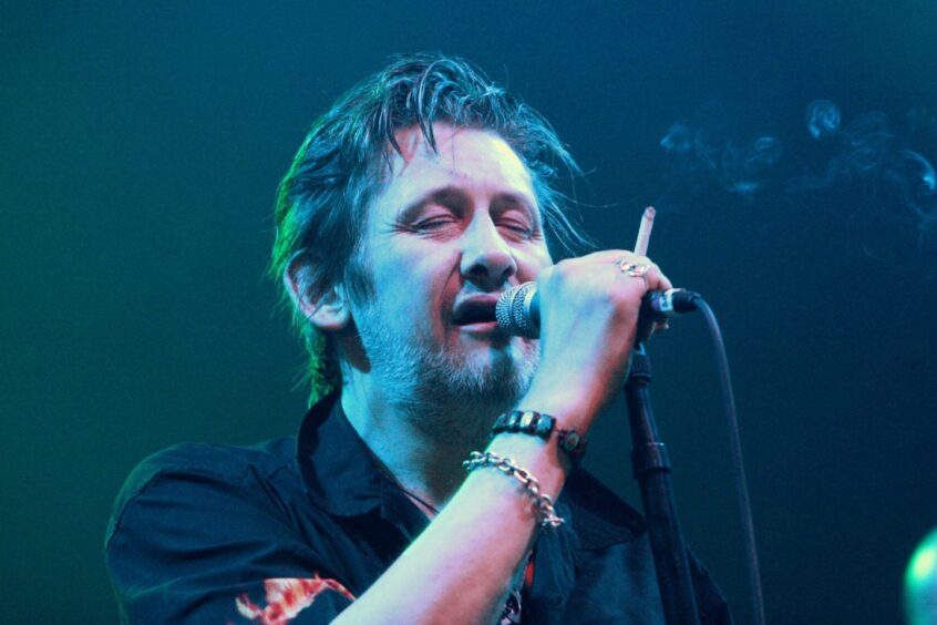 Shane MacGowan never let a cigarette leave his hand during the stormy gig. Image: DC Thomson.