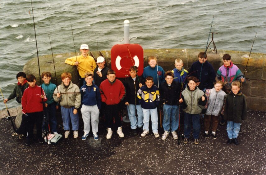 Youngsters line up to compete in the fishing competition in July 1993. Image: DC Thomson.