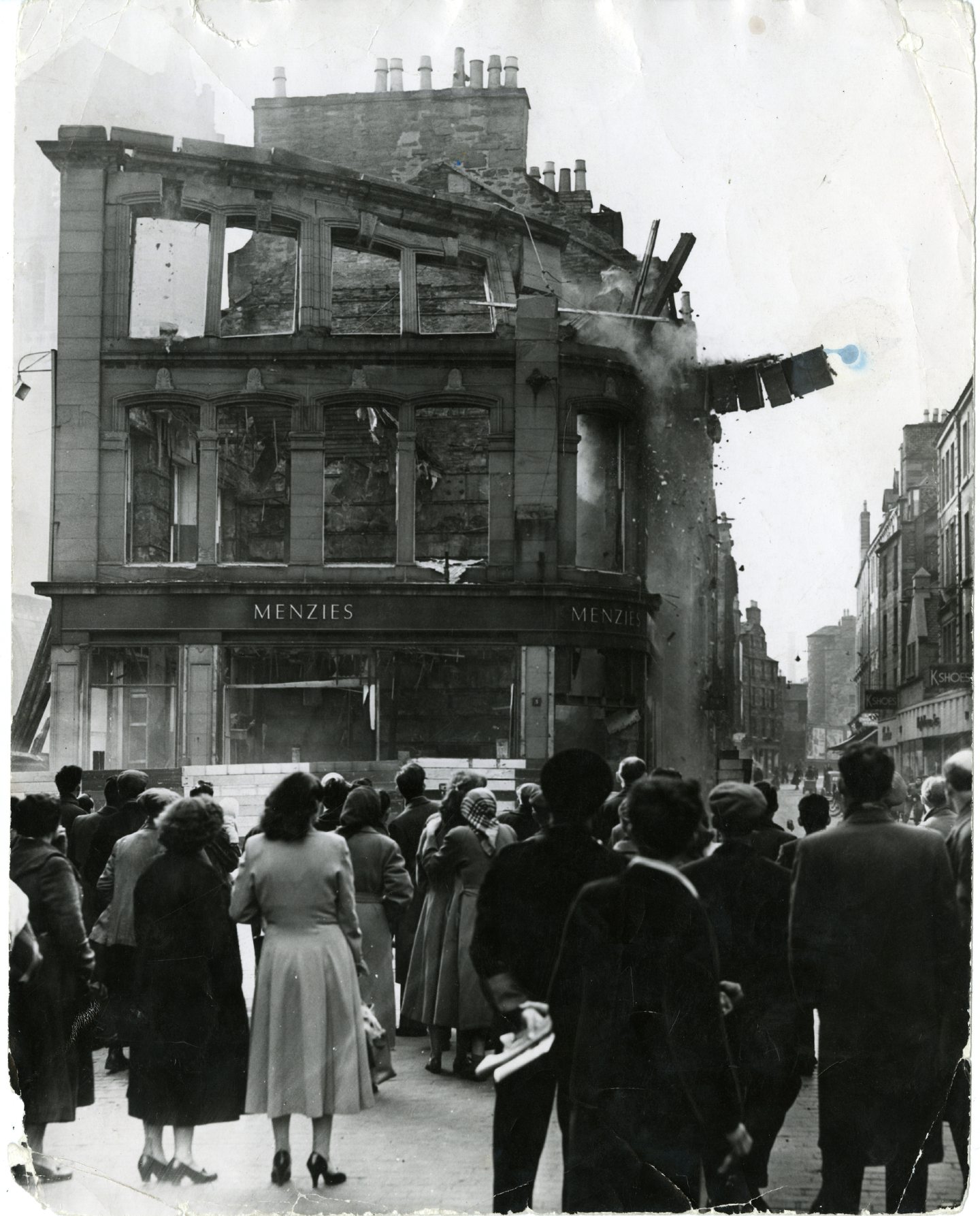 People watch the demolition of Menzies and Sons in 1957 as the old Overgate began to fall. Image: DC Thomson.