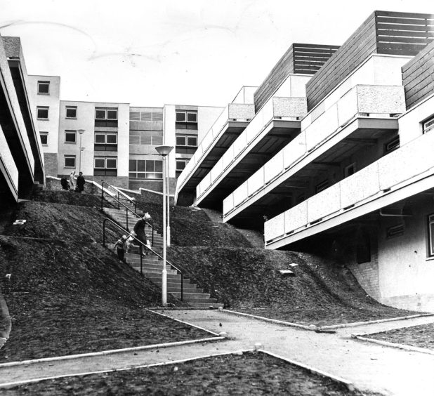 Whitfield estate in 1968. People walk down stairs between tower blocks.