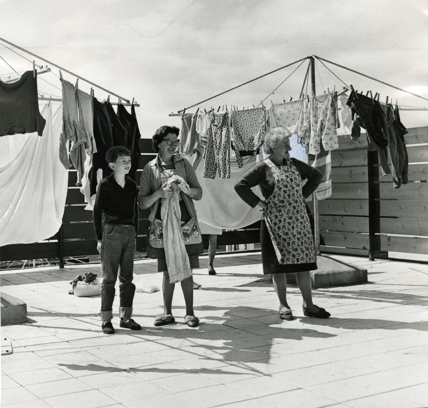 Two women and a young boy standing next to a drying rack in Whitfield in 1968. Image: DC Thomson.