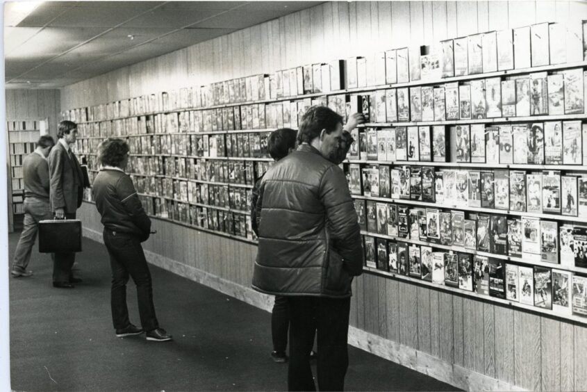 Shoppers at Magic Eye Video, Keiller Centre, Dundee, in 1982.