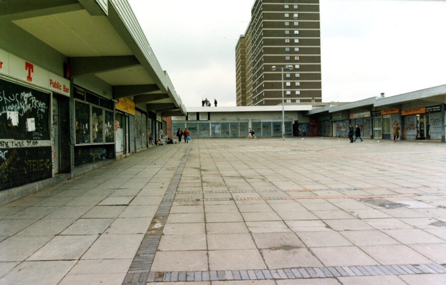 The shopping centre and multi-storey blocks - pictured in 1993 - are long gone. Image: DC Thomson.