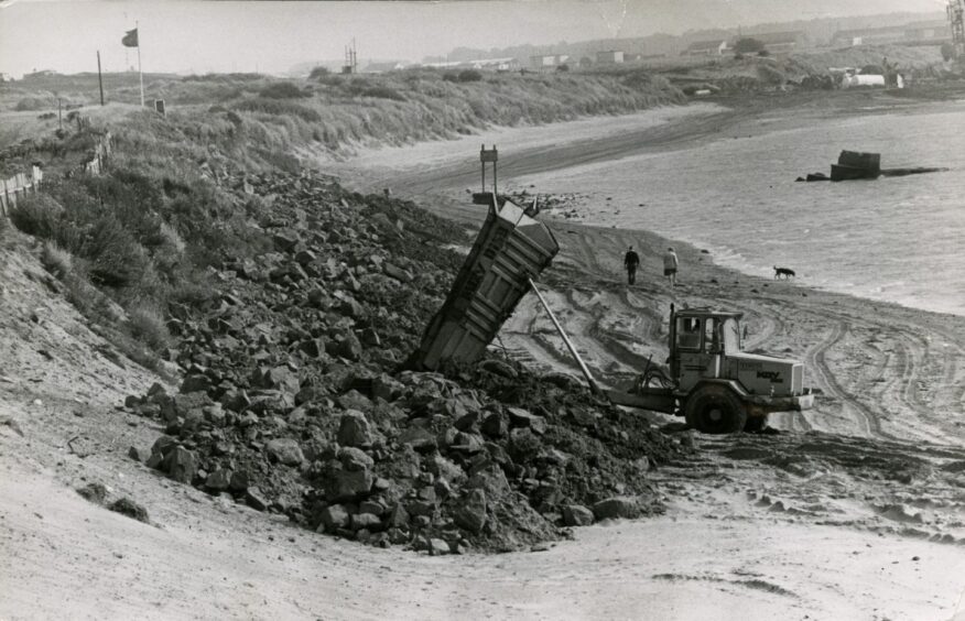 Diggers get to work on the massive task of shifting 24,000 metric tons of rock. Image: DC Thomson.