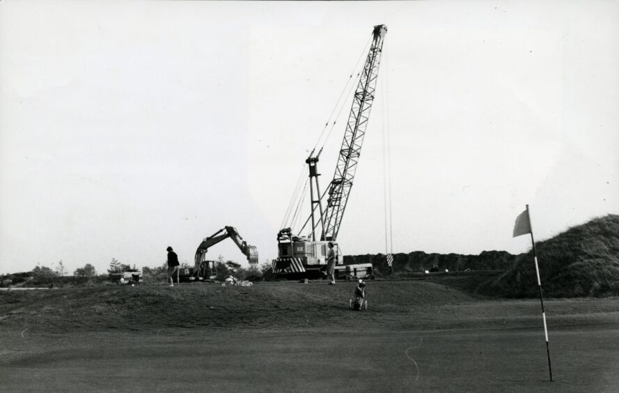 Image shows a digger at the side of the golf course. Image: DC Thomson.