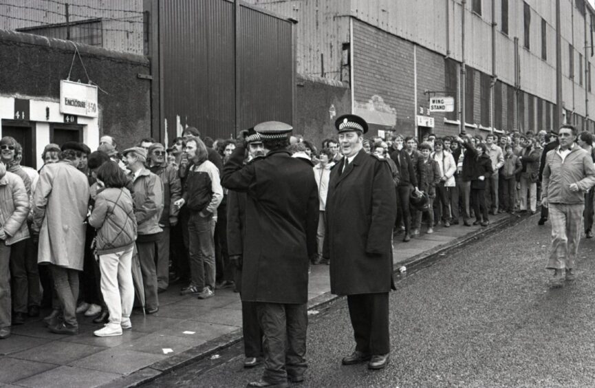 Spectators queueing to enter Dens Park for the title-decider. Image: DC Thomson.