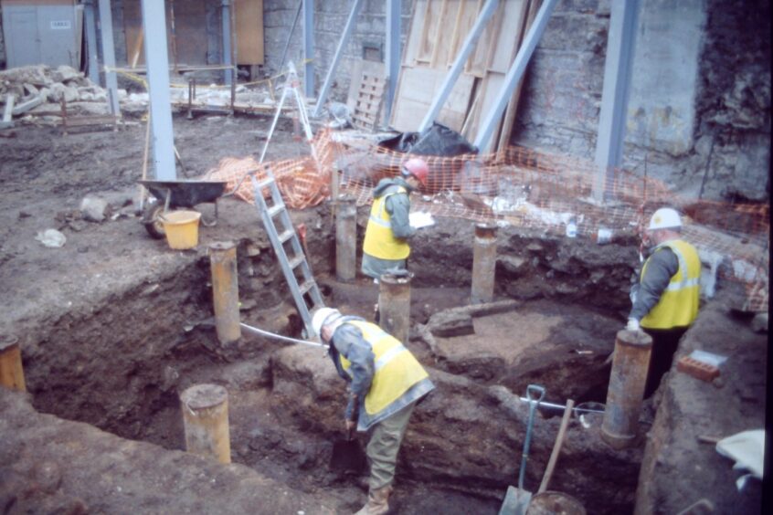 Working in a tight space on a dig. Image: Alder Archaeology.