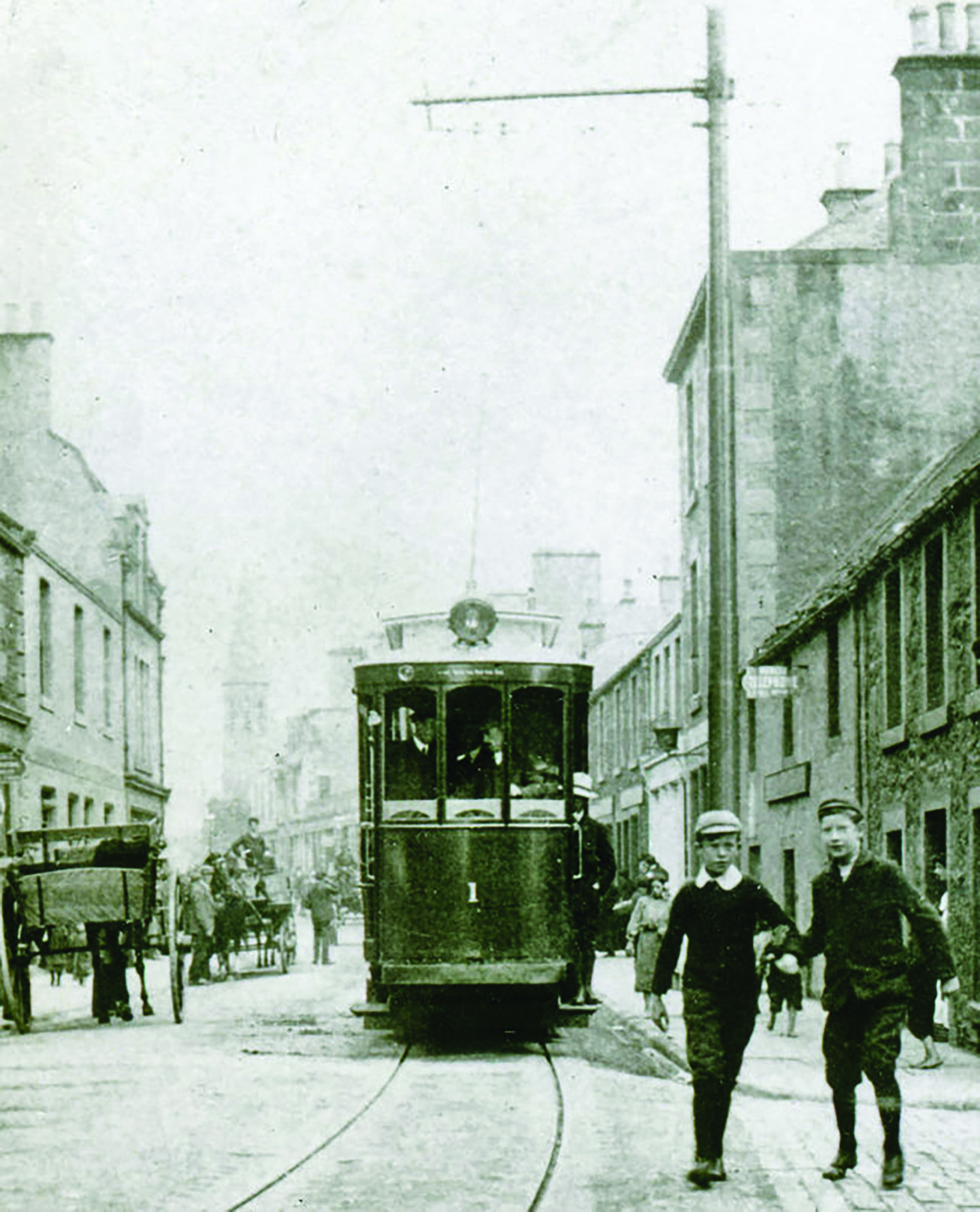 Car number 1 heading down Leven High Street on the first day of public operation. Image: Stenlake Publishing.