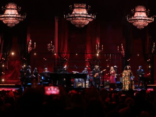 Elton John, Chris Stapleton, Sheryl Crow and Brittany Howard perform a tribute to Robbie Robertson during the in memoriam segment of the Rock & Roll Hall of Fame Induction Ceremony on Friday (Andy Kropa/Invision/AP)