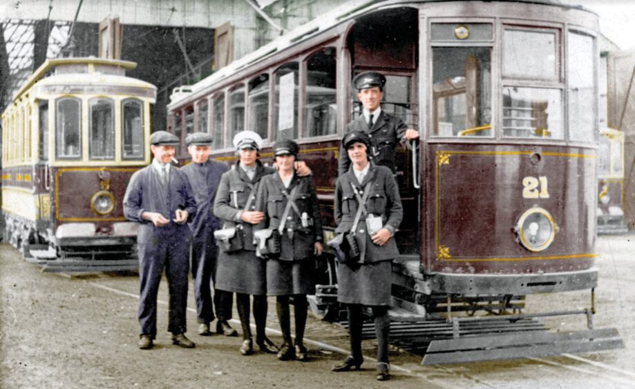 Staff pose for a photograph beside the Wemyss fleet. Image: Stenlake Publishing.