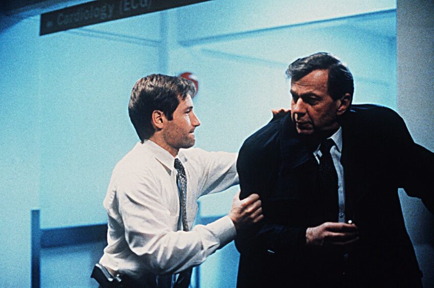 The Cigarette Smoking Man was Mulder's nemesis - with the pair pictured grappling - during the series, which started in 1993. Image: Shutterstock.
