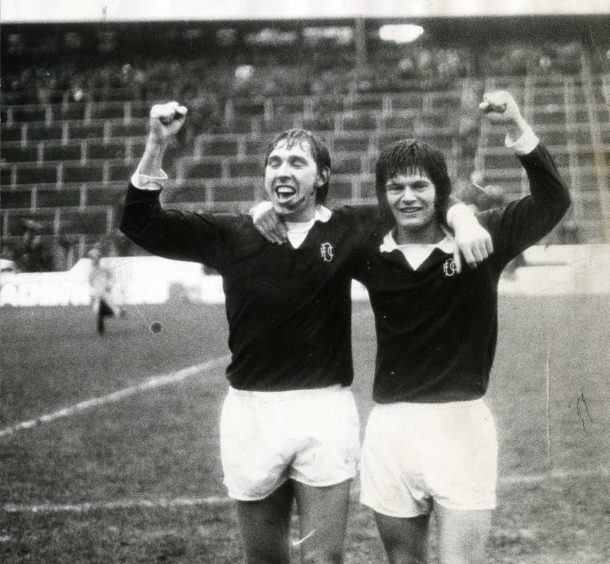 Stewart and Duncan celebrate against the backdrop of empty terracing at Hampden. Image: DC Thomson.