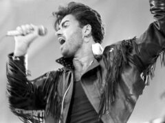 George Michael on stage at Wembley Stadium for the Wham! sell-out farewell concert (PA)