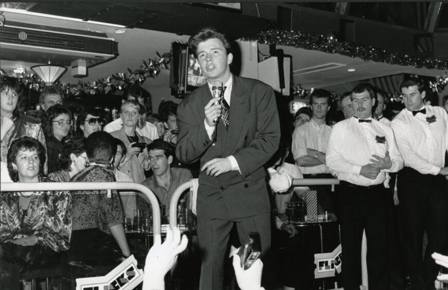 Rick Astley singing to fans at Flicks nightclub in Brechin. Image: DC Thomson.