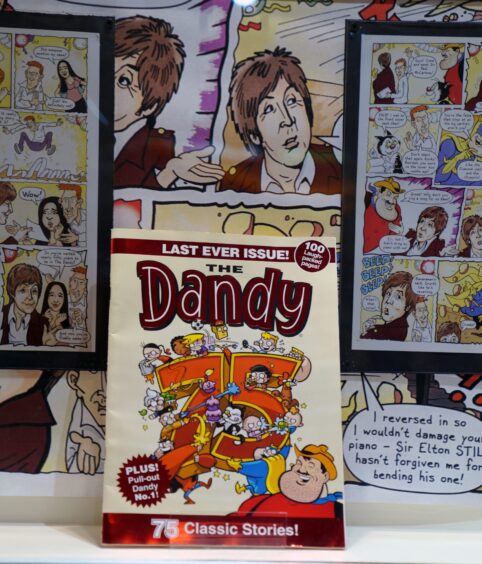 Artwork and a copy of the Dandy comic which features Sir Paul McCartney, formerly of the Beatles. 