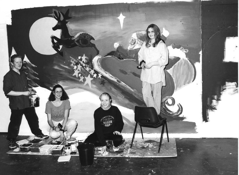 The Abbeygate Centre Christmas mural in 1995 being painted by Steven Byrne, Nicola Durno, Nicola Wilson and Gemma Jackson.