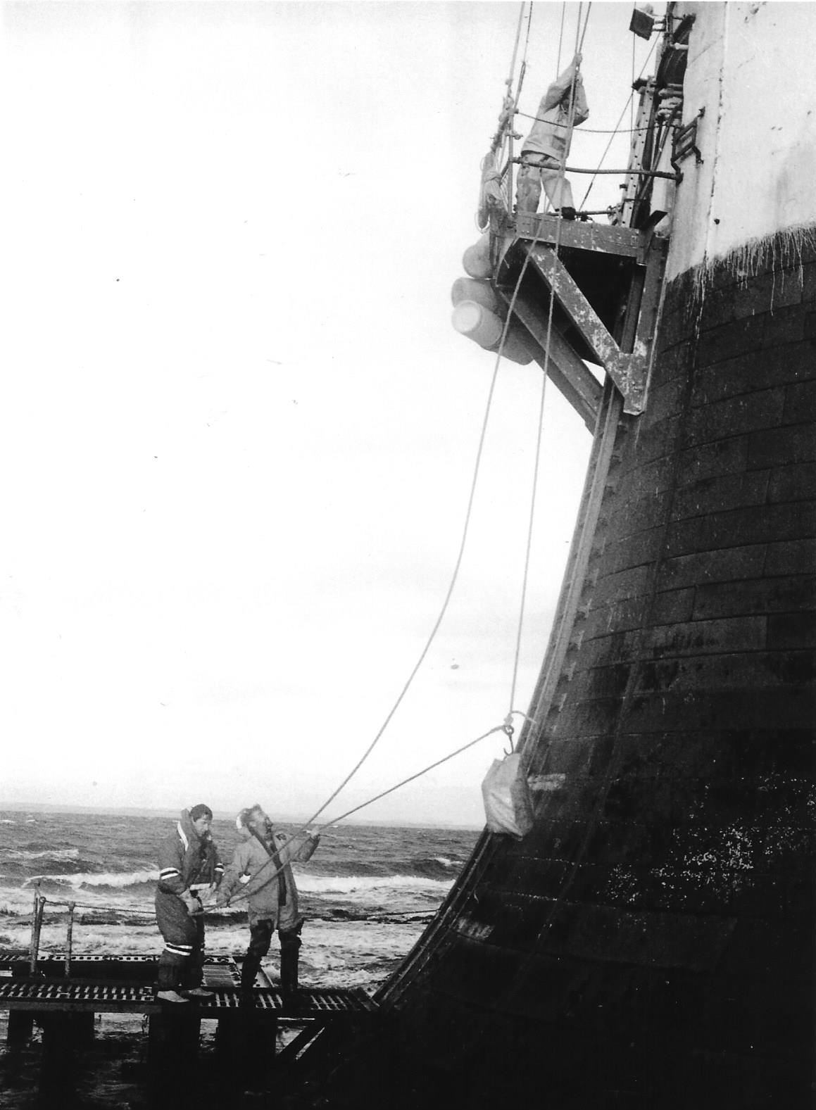 A parcel of festive fare is hoisted up to the door of the Bell Rock Lighthouse in December 1986.