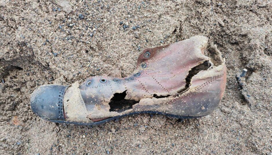 The football boot from the 1940s that emerged from the Dighty at Douglas in Dundee. Image: Supplied.