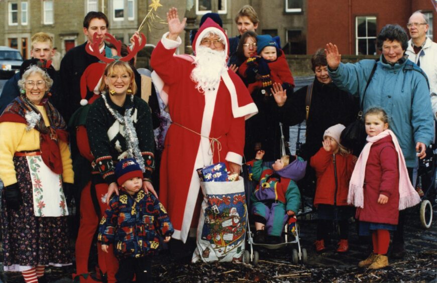 Santa with a small crowd at Broughty Ferry harbour