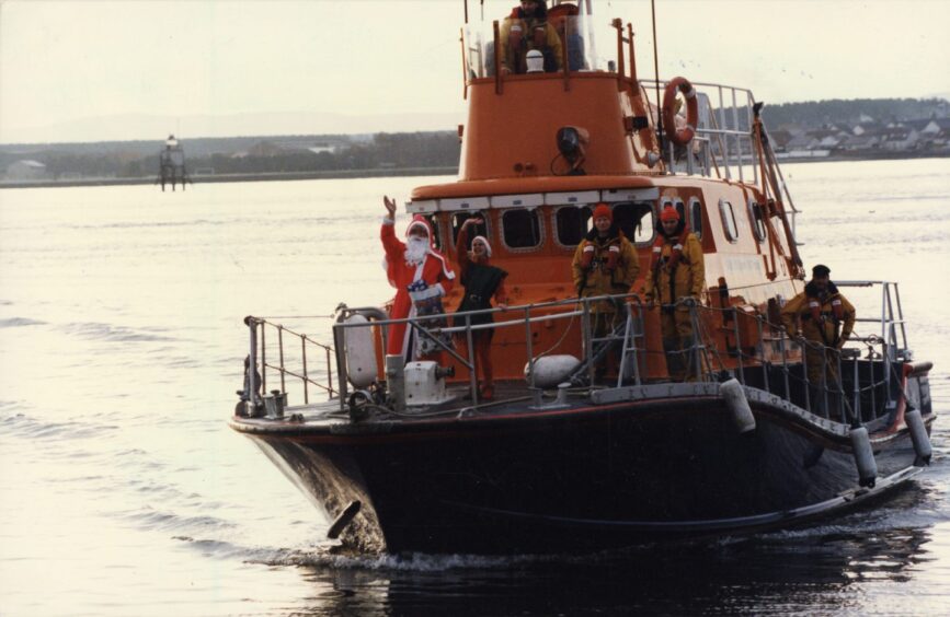 Santa waving from the lifeboat. 