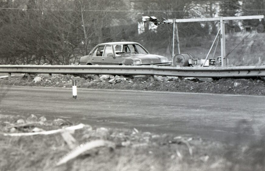 A wrecked car on the carriageway in Lockerbie, which was a scene of devastation. Image: DC Thomson.