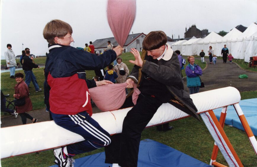 Two young boys hitting each other with cushions at the gala. Image: DC Thomson.