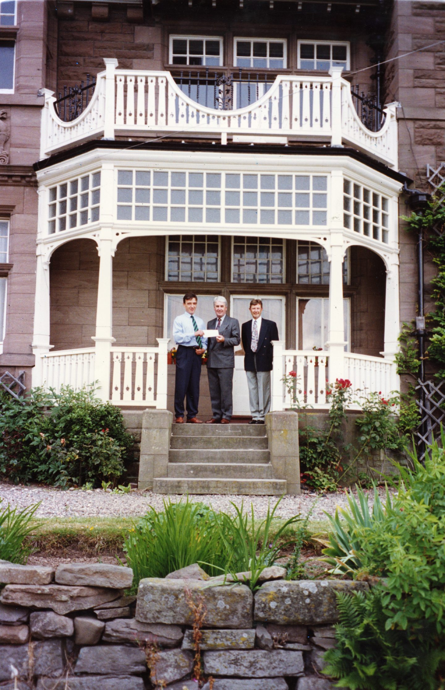 Neil Sword, Cllr Andy Lynch and architect Nigel Gillan outside Aystree House