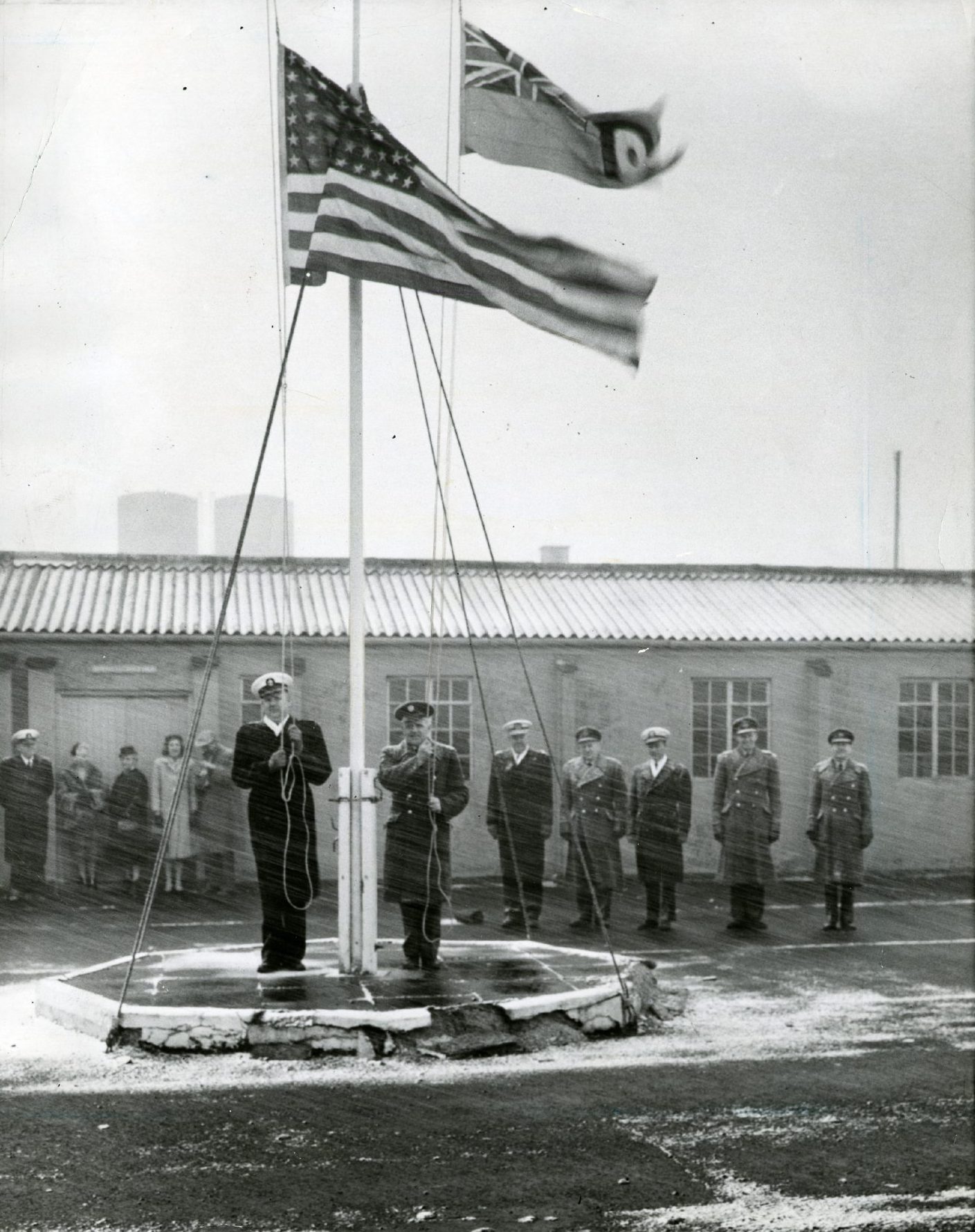 Raising of the flags at the opening of the RAF base in Edzell in 1960 during a snowstorm. 
