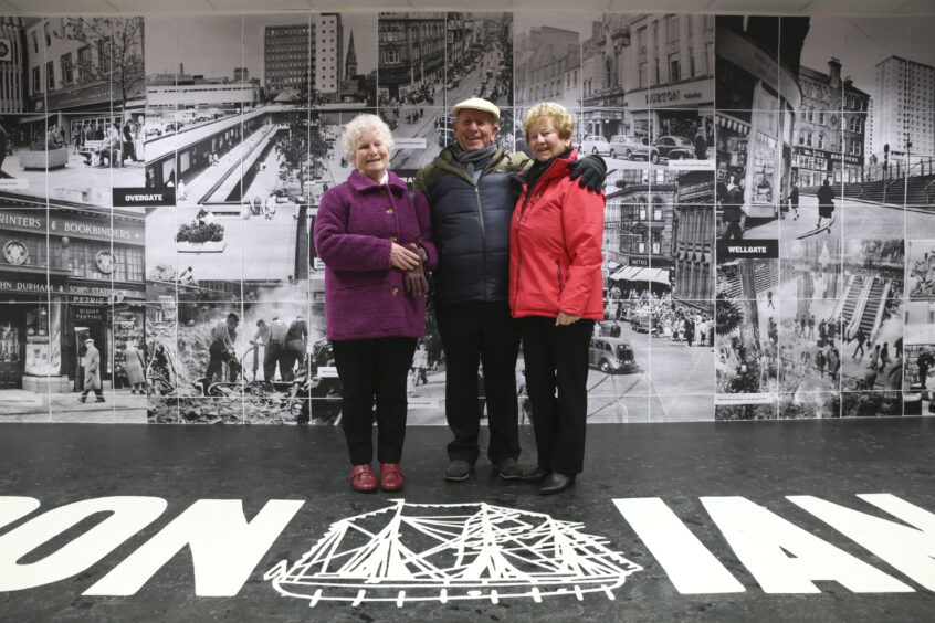 Some of the visitors who have been enjoying the Dundee shops exhibition smile for the photographer. Image: Kathryn Rattray.
