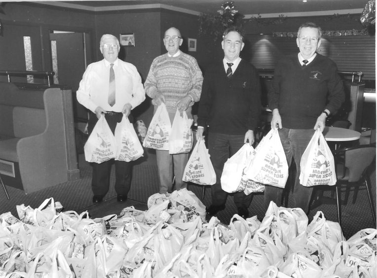 Ron Falconer, Archie Murray, Hugh McCashey and George Barnet with the Legion parcels for Arbroath pensioners in 1995. 