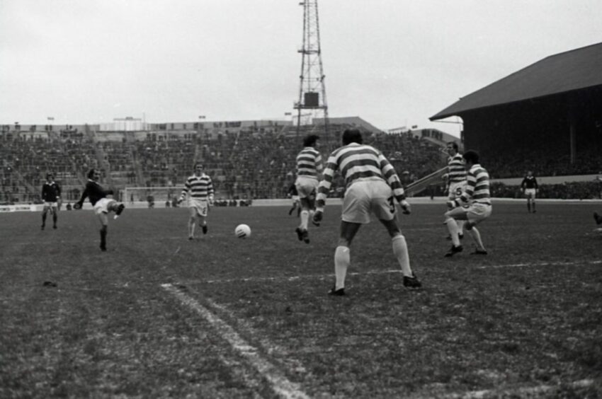 A Dundee player shoots at the Celtic goal during the League Cup final