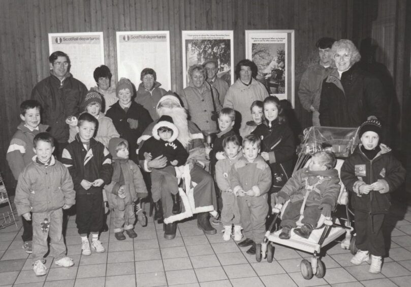 Santa with children and adults at Arbroath Railway station. Image: Supplied.