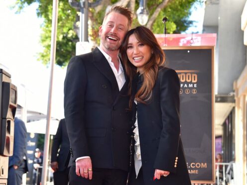 Macaulay Culkin and Brenda Song attend a ceremony honouring Culkin with a star on the Hollywood Walk of Fame on Friday (Jordan Strauss/AP)