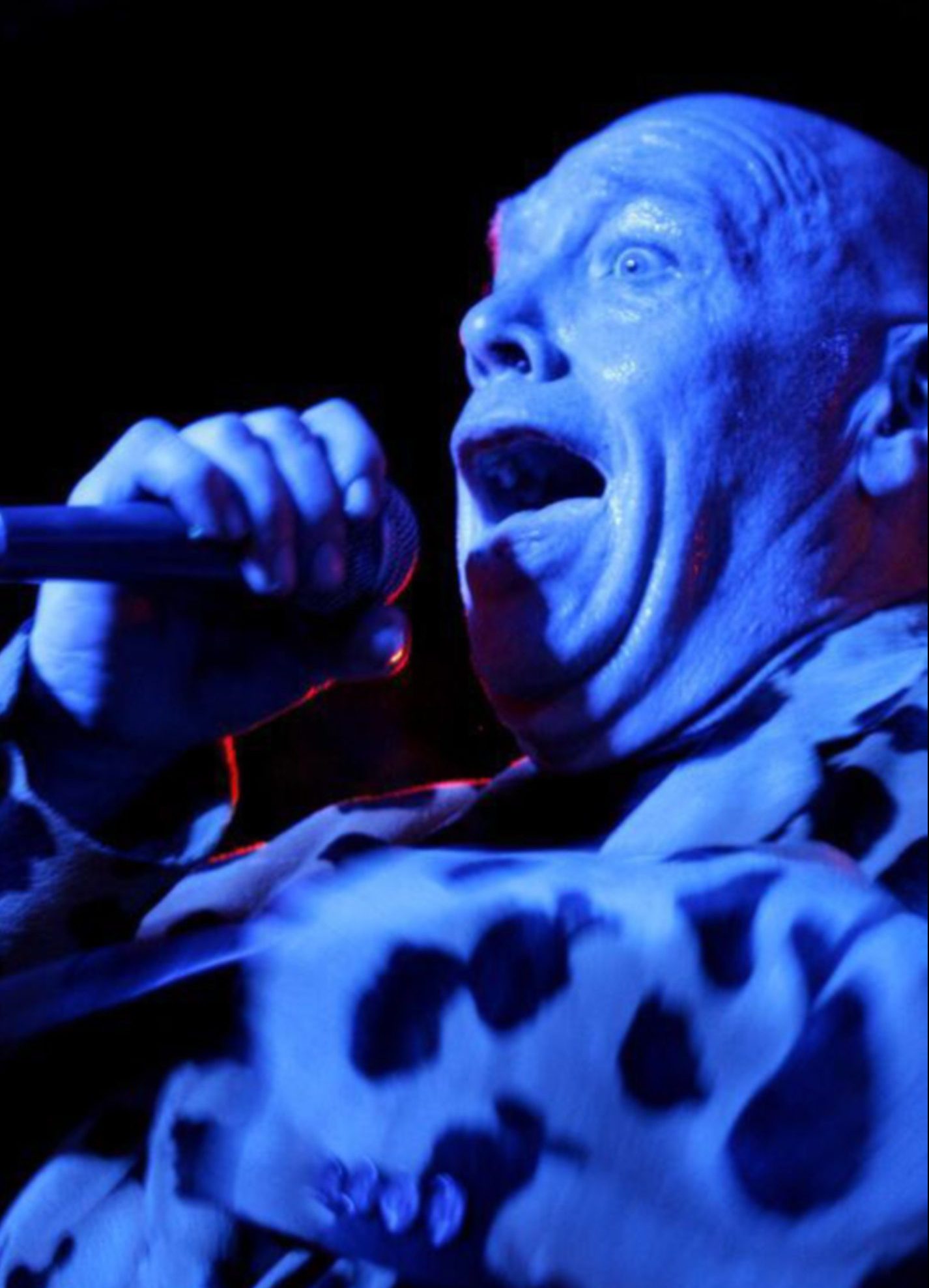Buster Bloodvessel sings into the mic