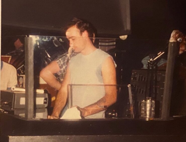 DJ Phil Jordan behind the decks after taking over in 1983. Image: Tony Cochrane.