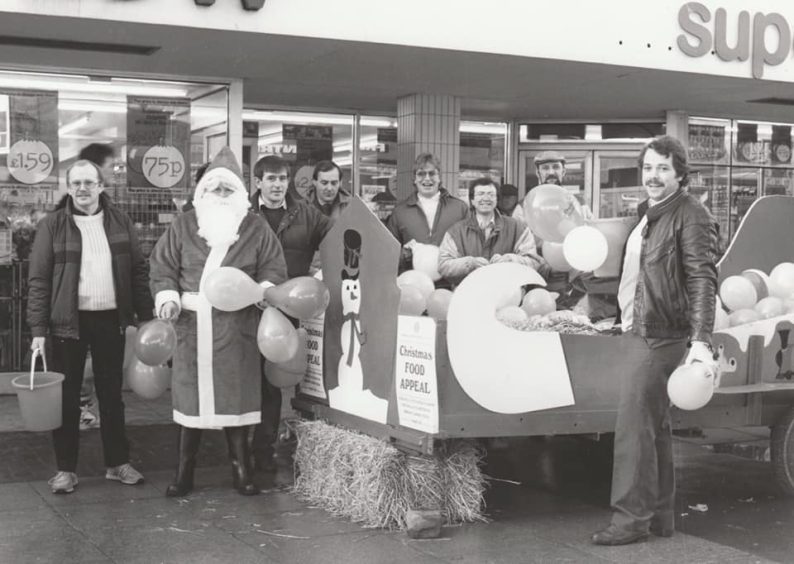 Arbroath Round Table members outside Willie Low's in the precinct in 1986, collecting for the annual Christmas food appeal for Arbroath's needy OAPs.