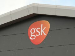 Drugs giant GSK has upgraded its long-term profit outlook after unveiling higher annual sales and profits thanks to the launch of a new blockbuster vaccine (Andy Buchanan/PA)