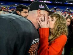 Taylor Swift kisses Kansas City Chiefs tight end Travis Kelce (Julio Cortez/AP)