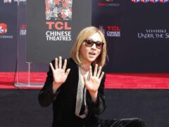 Yoshiki’s hand and footprint ceremony immortalising him in the forecourt of the TCL Chinese Theatre in Hollywood (Alamy)