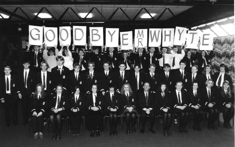 Arbroath High School senior pupils hold up a sign reading Goodbye Mr Whyte