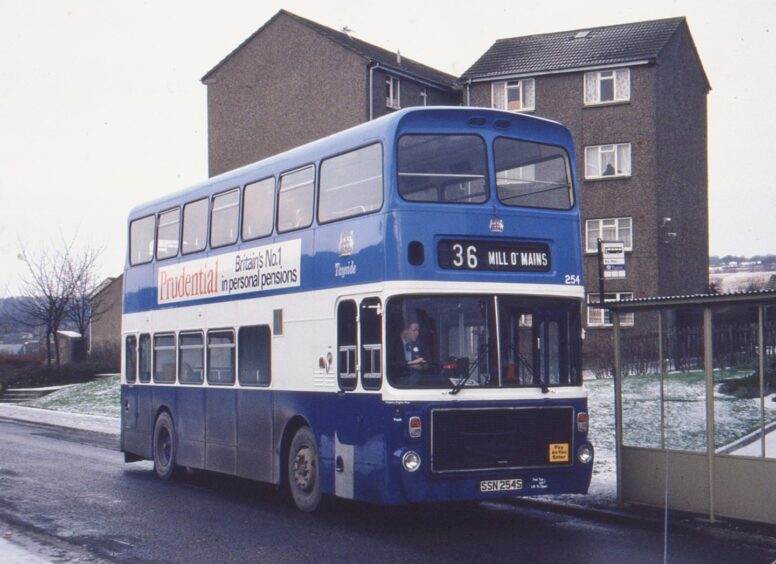 A Volvo Ailsa bus, the 254, sits at the Mill O'Mains terminus on a cold winter's day in 1985.