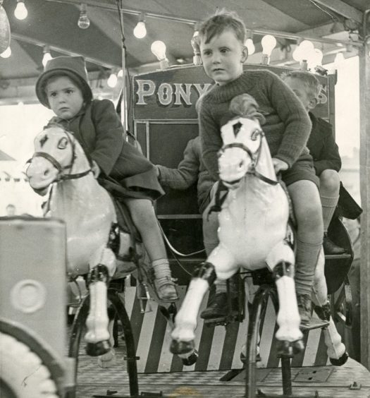 Children enjoying the Pony Express ride at the Gussie Park Carnival in Dundee in 1961.
