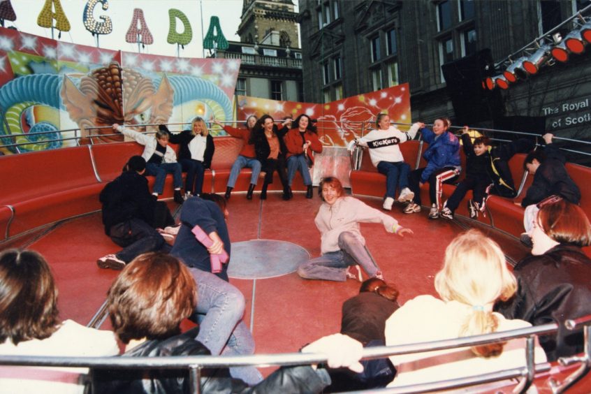 People holding on, on the Tagada ride at the Dundee street carnival in 1998. 