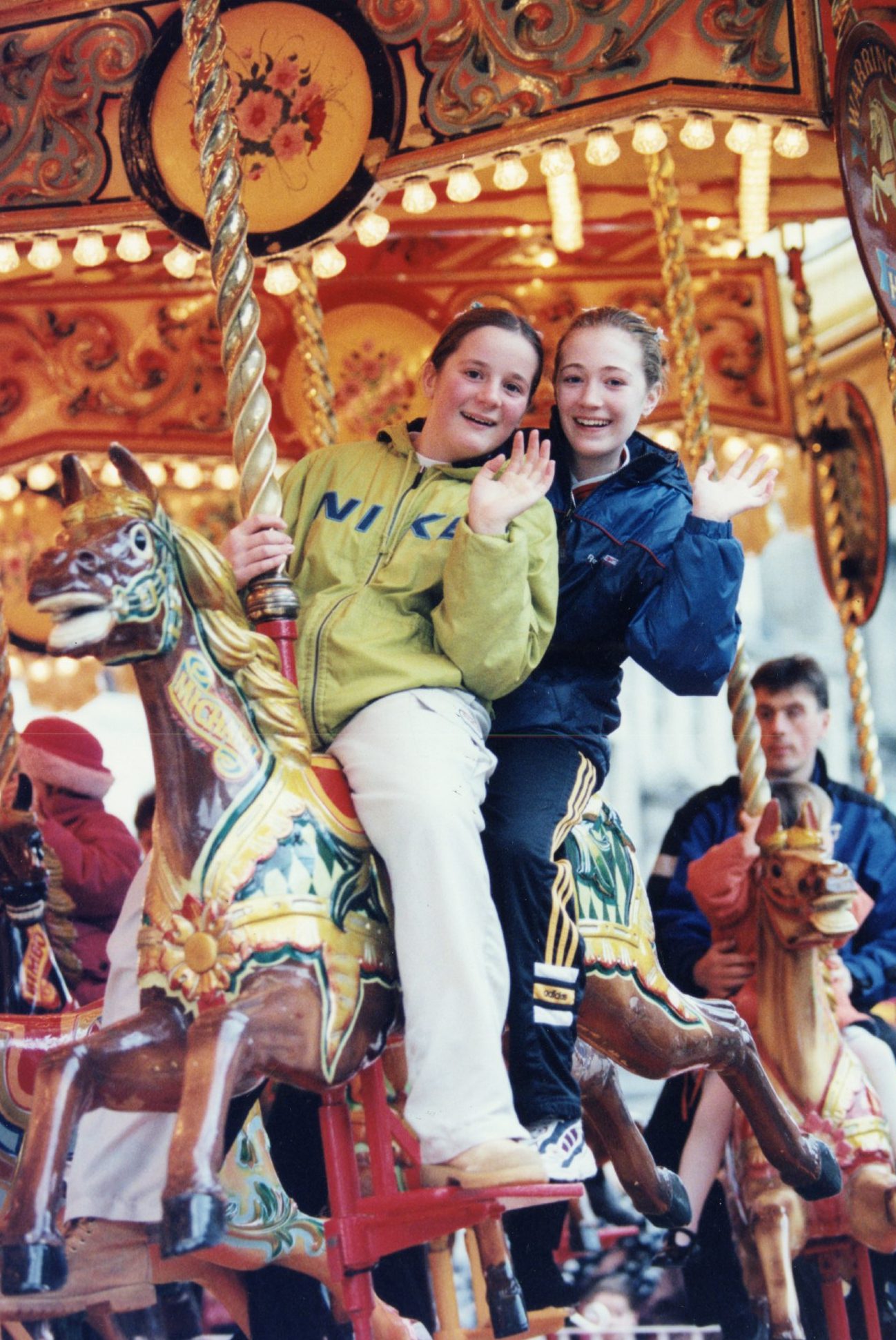 Two teenaged girls having fun on the Victorian Carousel in City Square in 1999. 