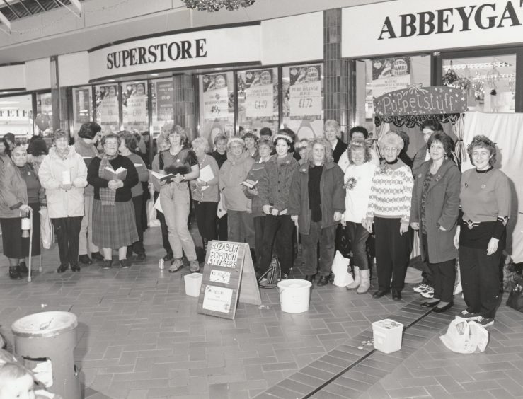 The Elizabeth Gordon Singers entertained Abbeygate centre customers in December 1997 to raise money for Help for Abandoned Animals.