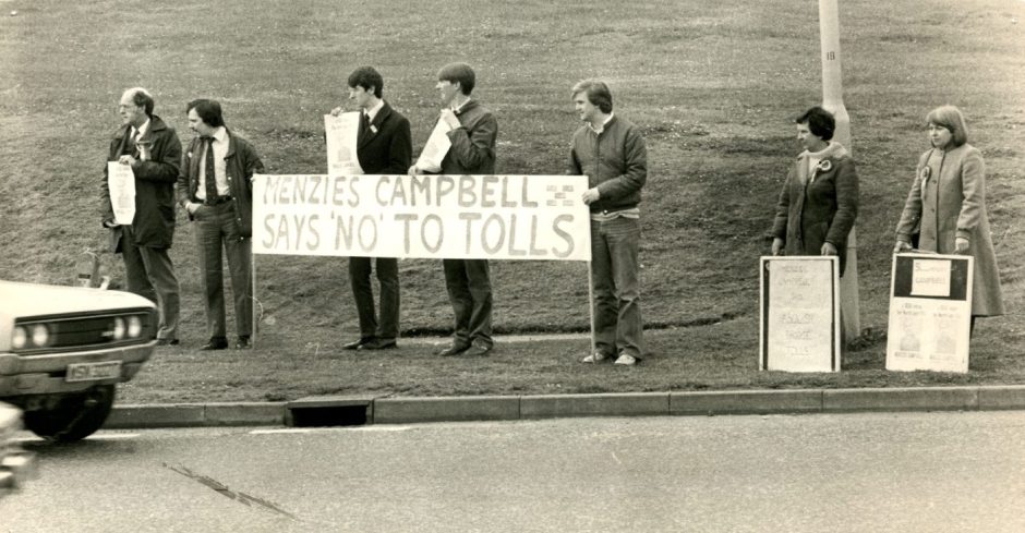 People hold up placards in a demonstration against the Tay Road Bridge tolls in 1983.