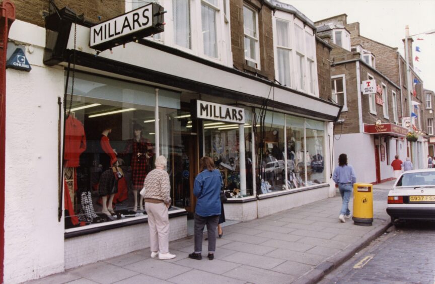 Customers looking in the Millars shop window at the mannequin displays in 1992.