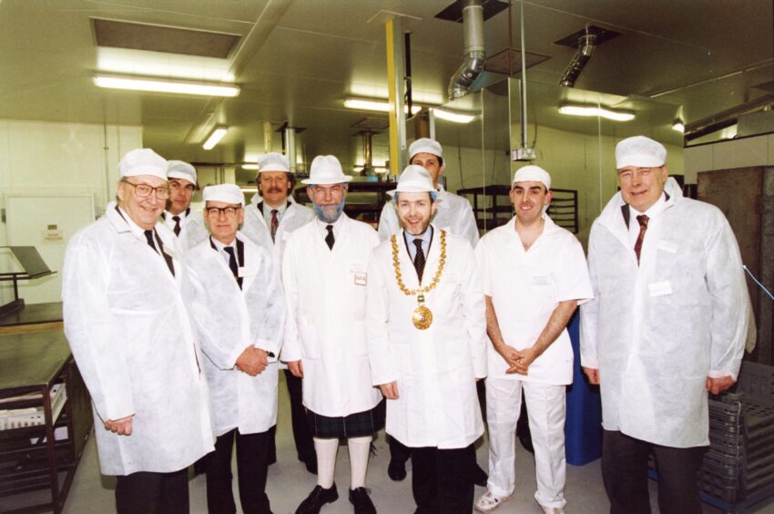 Lord Provost Tom McDonald joins staff at the bakery opening