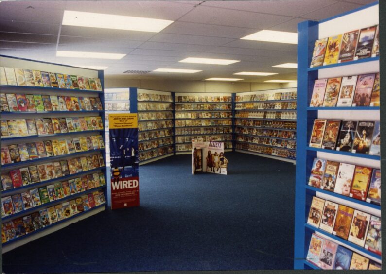 Shelves full of video tapes at Video Drive-In in 1990.