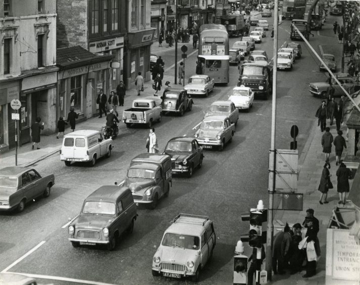 Millars can be seen at the Nethergate and Union Street junction in 1966, as people and cars pass by